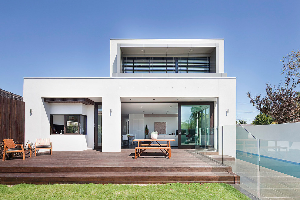 Design ideas for a modern two-storey white exterior in Melbourne with a flat roof.
