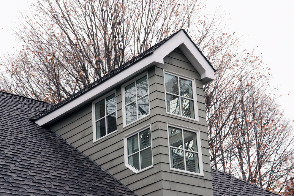 Example of a trendy gray two-story vinyl exterior home design in Other