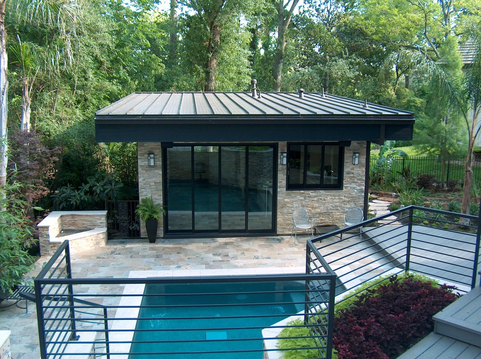 Design ideas for a modern rectangular pool in Houston with a pool house.