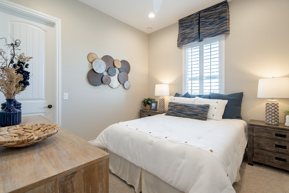 Mid-sized contemporary guest bedroom in Phoenix with beige walls, carpet and beige floor.