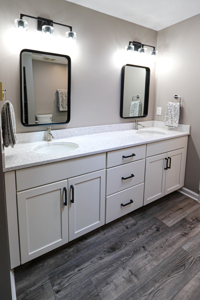 All White Bathroom with Black Hardware and Gray Flooring Transitional