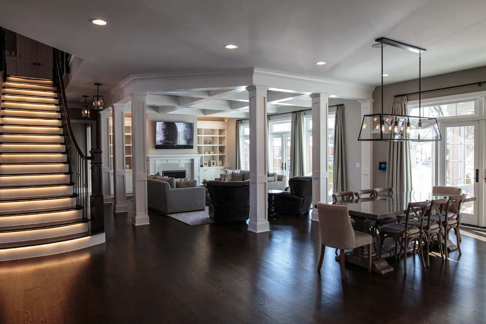 This is an example of a large transitional hallway in Chicago with grey walls and dark hardwood floors.