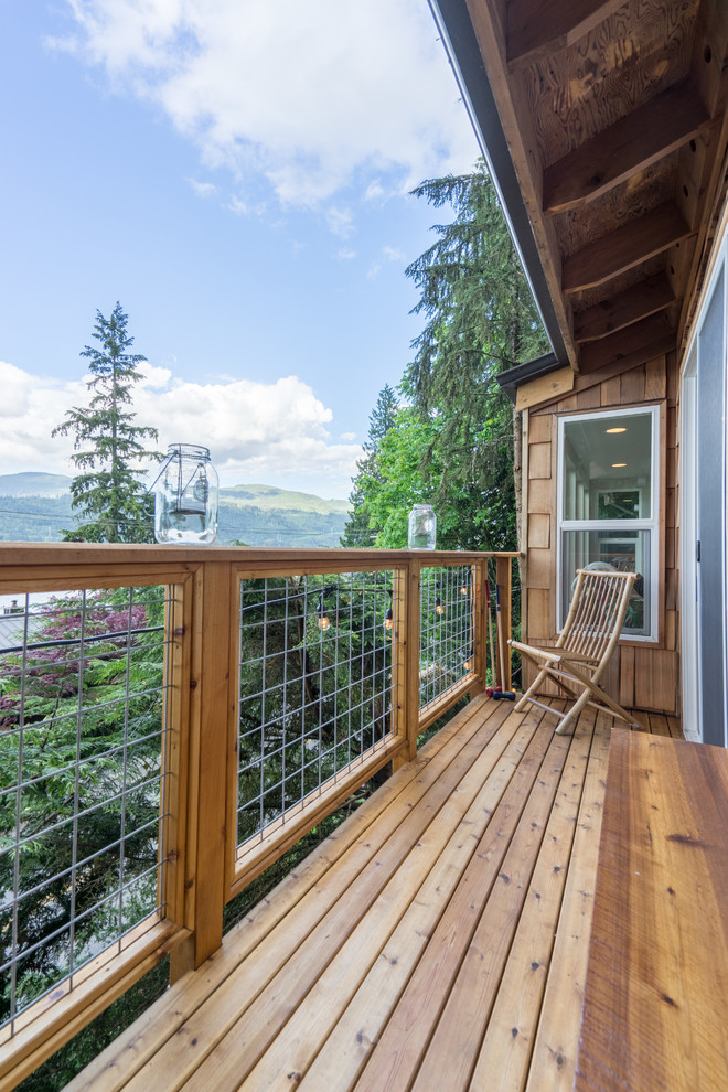 Small country balcony in Seattle with a roof extension.