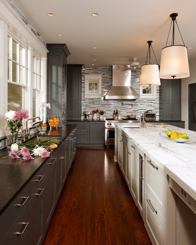 Transitional kitchen photo in Chicago with an undermount sink, shaker cabinets, gray cabinets, gray backsplash, matchstick tile backsplash and stainless steel appliances