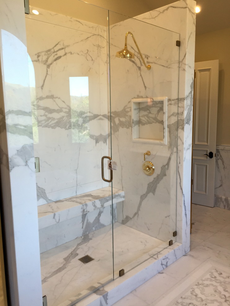 Inspiration for an expansive traditional master bathroom in San Francisco with furniture-like cabinets, dark wood cabinets, a freestanding tub, a corner shower, a one-piece toilet, white tile, porcelain tile, beige walls, marble floors, an integrated sink and marble benchtops.