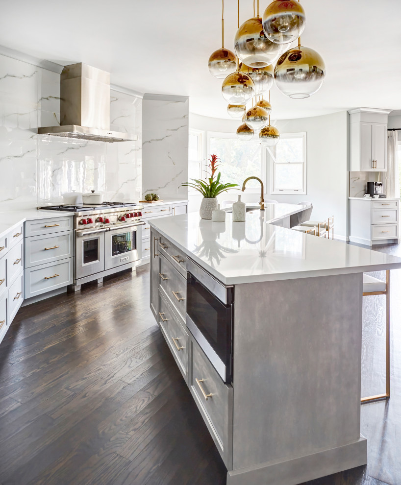 Large transitional galley dark wood floor and brown floor eat-in kitchen photo in Chicago with an undermount sink, shaker cabinets, gray cabinets, quartzite countertops, white backsplash, porcelain backsplash, stainless steel appliances, an island and white countertops
