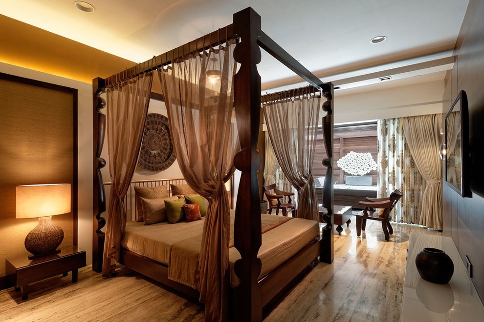 Photo of a mid-sized contemporary bedroom in Pune with brown floor.