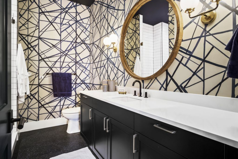 Inspiration for a contemporary bathroom in Denver with shaker cabinets, black cabinets, black walls, mosaic tile floors, black floor, white benchtops, a single vanity, a built-in vanity and wallpaper.