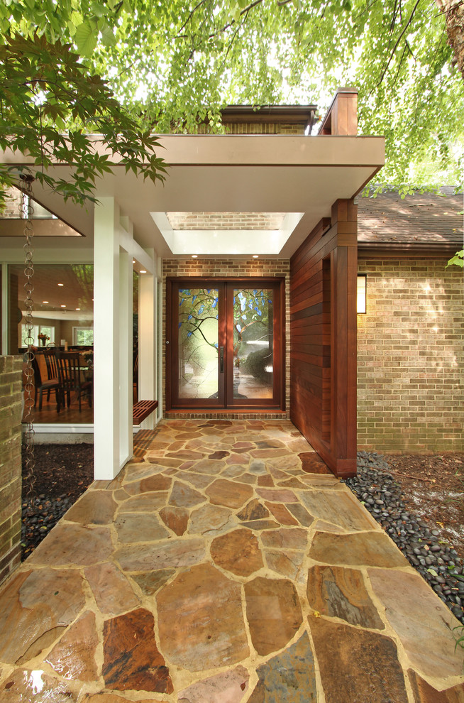 Inspiration for a contemporary front door in DC Metro with a double front door and a glass front door.