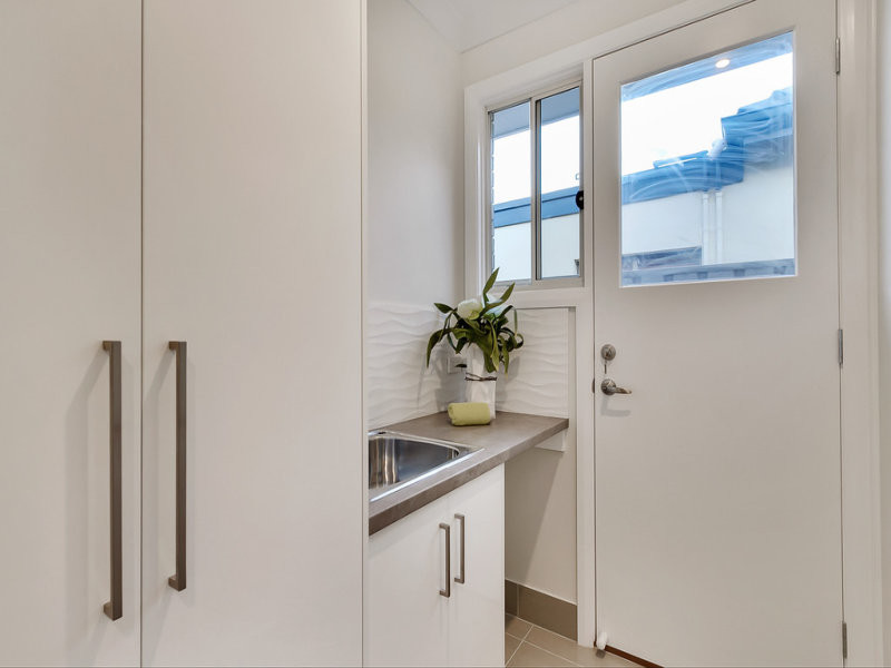 Design ideas for a transitional laundry room in Adelaide.