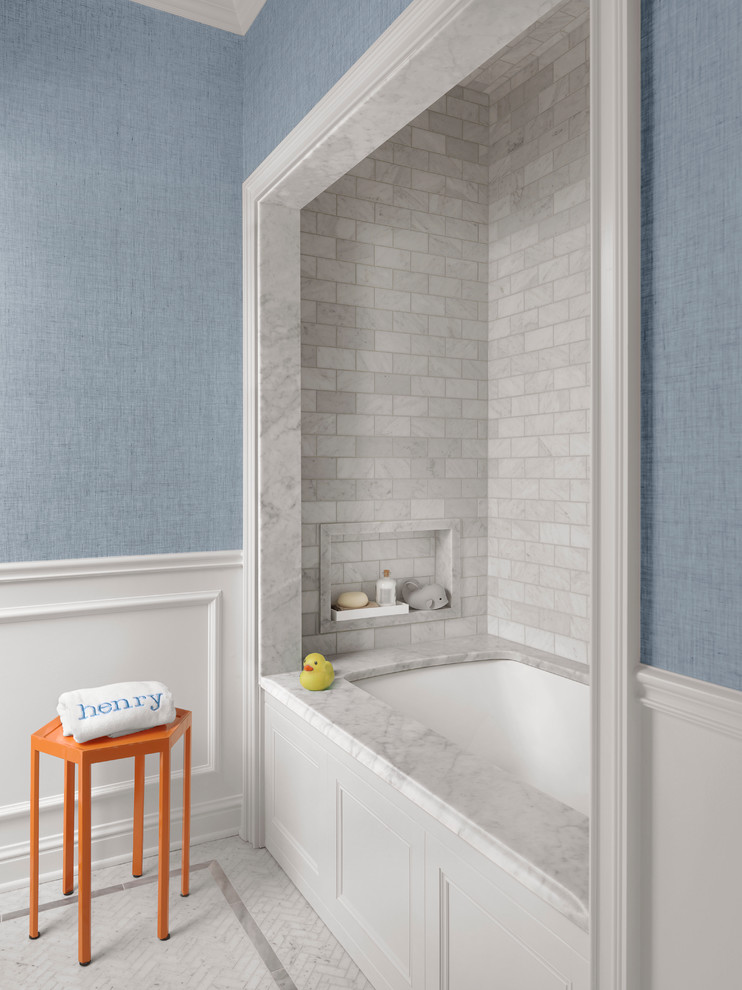 Photo of a mid-sized traditional kids bathroom in St Louis with an undermount tub, gray tile, marble, blue walls, mosaic tile floors and white floor.