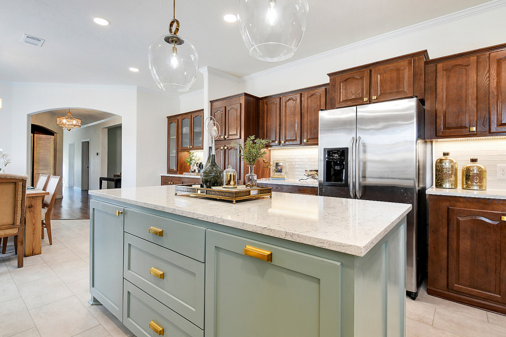 Eat-in kitchen - mid-sized transitional ceramic tile and white floor eat-in kitchen idea with an undermount sink, raised-panel cabinets, dark wood cabinets, quartz countertops, white backsplash, glass tile backsplash, stainless steel appliances, an island and white countertops