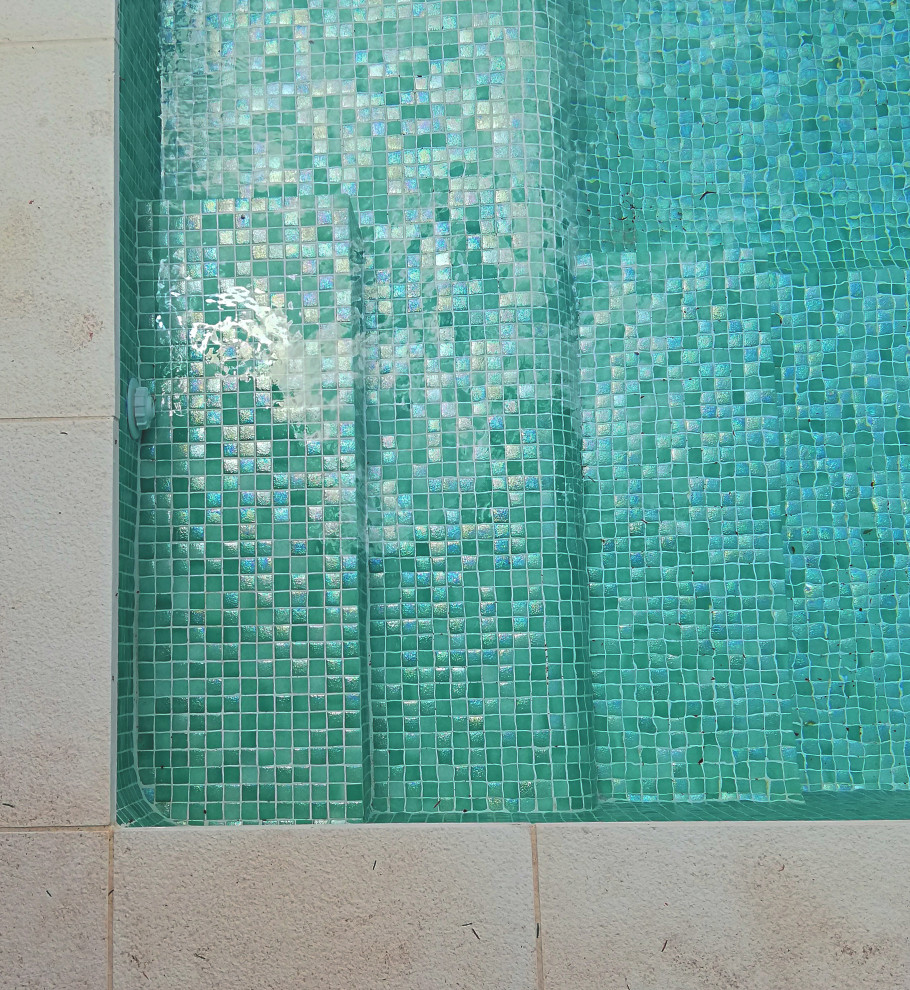 Photo of a mid-sized modern custom-shaped pool in Madrid with with a pool.