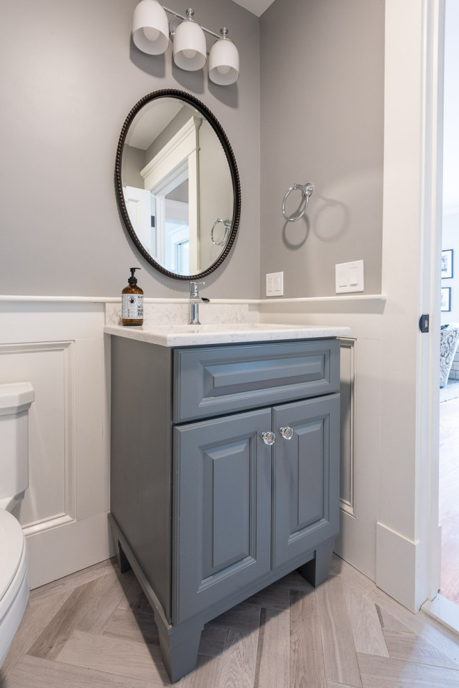 Inspiration for a small transitional bathroom in Boston with raised-panel cabinets, grey cabinets, grey walls, porcelain floors, an undermount sink, engineered quartz benchtops, white benchtops, a single vanity and a floating vanity.