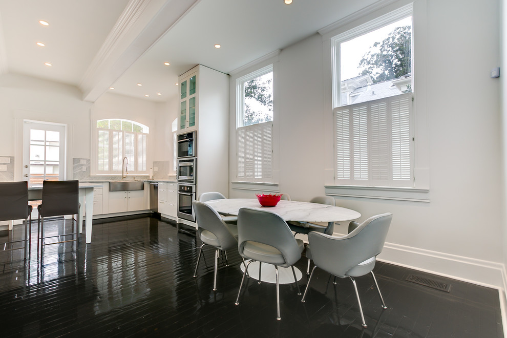 This is an example of a large transitional dining room in New Orleans.