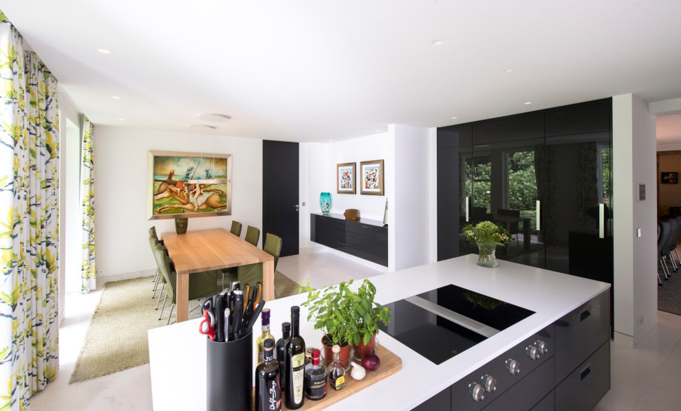 This is an example of a large modern eat-in kitchen in Other with a drop-in sink, flat-panel cabinets, solid surface benchtops, white splashback, stainless steel appliances, marble floors, with island, white floor and white benchtop.