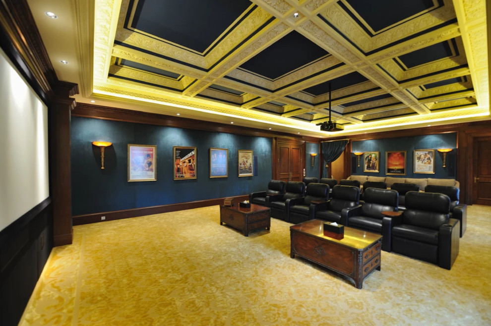 Large traditional open concept home theatre in Los Angeles with blue walls, carpet, a projector screen and beige floor.