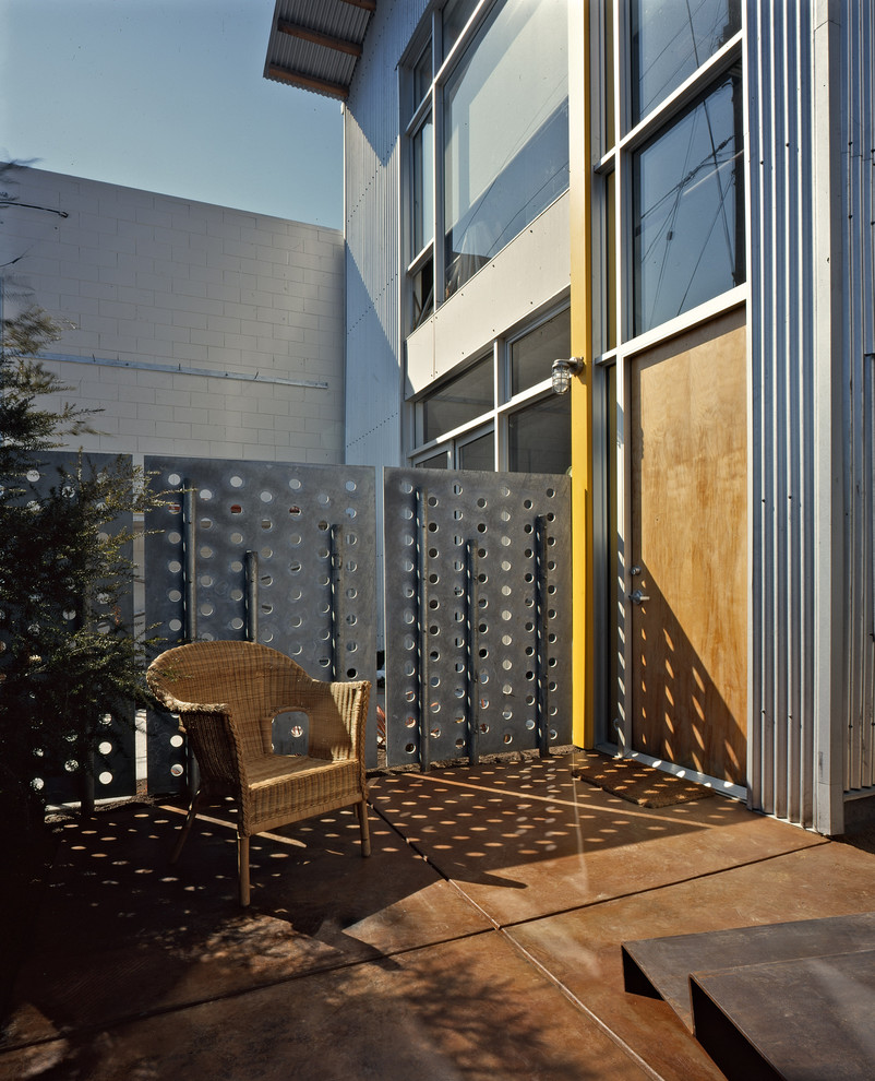 Photo of a contemporary front door in San Francisco with a single front door and a light wood front door.