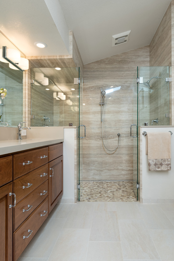 Photo of a mid-sized traditional master bathroom in Other with medium wood cabinets, a freestanding tub, a double shower, a one-piece toilet, beige tile, porcelain tile, beige walls, porcelain floors, an undermount sink, granite benchtops and raised-panel cabinets.