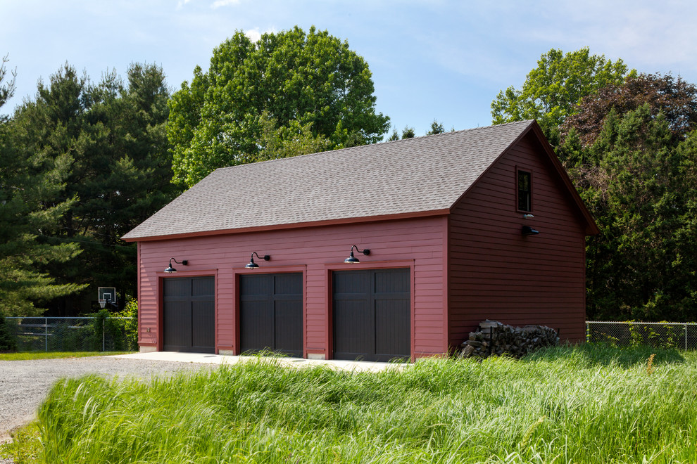Inspiration for a country detached three-car garage in Boston.