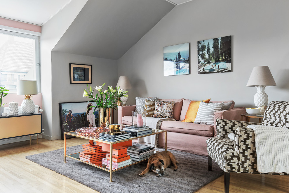 Design ideas for a large eclectic formal open concept living room in Stockholm with grey walls, light hardwood floors, a standard fireplace and no tv.