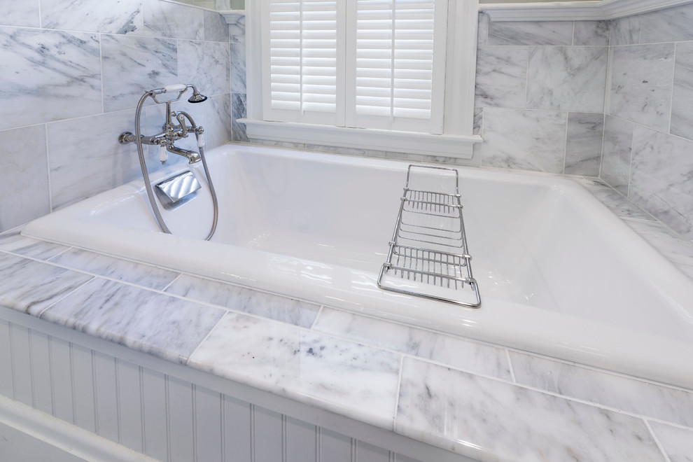 Mid-sized traditional master bathroom in Cincinnati with white cabinets, marble benchtops, a drop-in tub, white tile, subway tile, marble floors, an undermount sink, recessed-panel cabinets, a corner shower, a two-piece toilet and green walls.