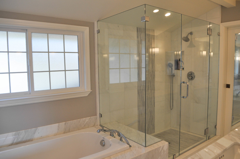 Inspiration for a large traditional master bathroom in San Francisco with recessed-panel cabinets, white cabinets, a drop-in tub, a corner shower, a two-piece toilet, white tile, marble, brown walls, marble floors, an undermount sink, marble benchtops, white floor and a hinged shower door.