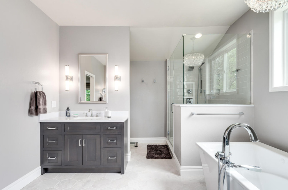 Photo of a large transitional master bathroom in Denver with beaded inset cabinets, grey cabinets, an undermount sink, engineered quartz benchtops, a hinged shower door, white benchtops, a double vanity and a built-in vanity.