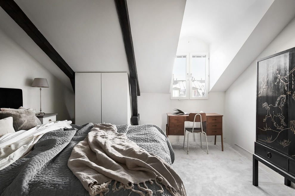 Photo of a scandinavian master bedroom in Stockholm with white walls, carpet, grey floor and no fireplace.