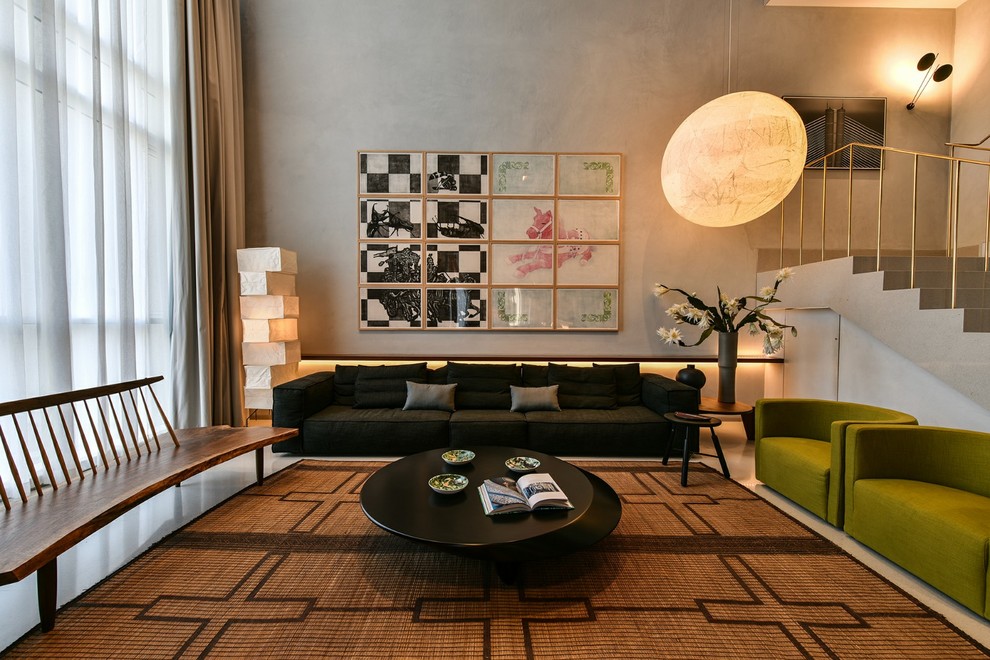 This is an example of a Mid-sized contemporary living room in Pune With Grey Walls.
