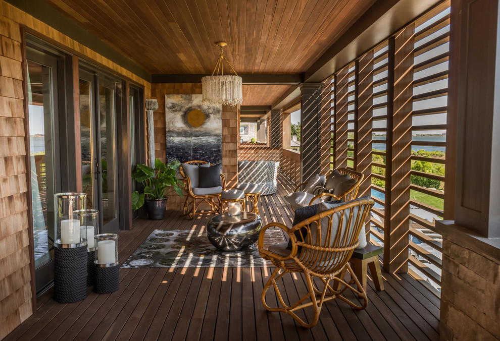 This is an example of a tropical deck in New York with a roof extension.