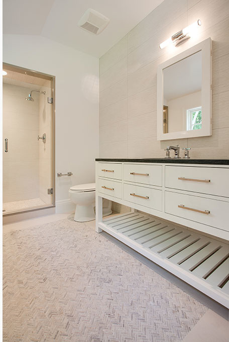 Large transitional alcove shower photo with flat-panel cabinets, white cabinets, beige walls, an undermount sink and a hinged shower door
