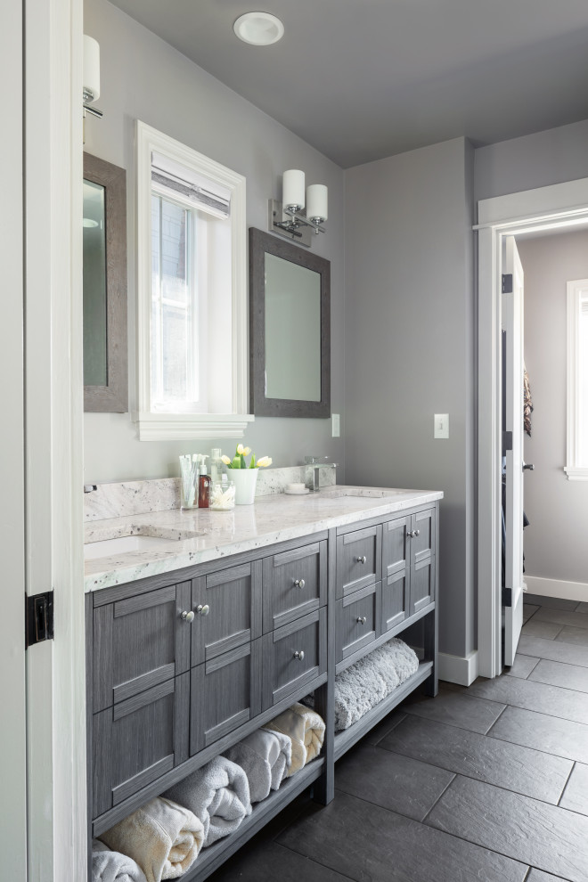 Photo of a mid-sized country 3/4 bathroom in Seattle with shaker cabinets, grey cabinets, white tile, grey walls, porcelain floors, an undermount sink, engineered quartz benchtops, grey floor, white benchtops, a double vanity and a freestanding vanity.