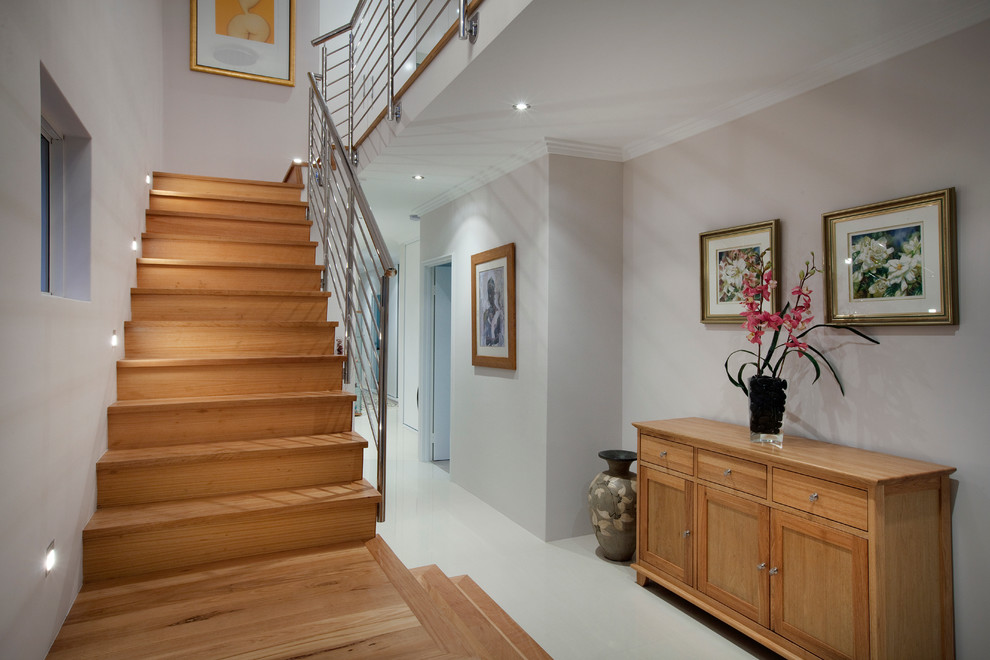 Photo of a mid-sized contemporary wood u-shaped staircase in Perth.