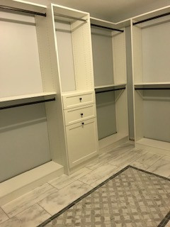 Large walk-in Closet with Shaker-Style Drawers and Double-Hang Space