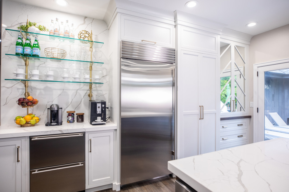 Eat-in kitchen - transitional medium tone wood floor and brown floor eat-in kitchen idea with shaker cabinets, white cabinets, quartz countertops, white backsplash, quartz backsplash, stainless steel appliances, two islands and white countertops