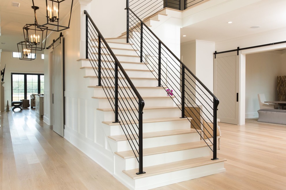 Photo of a contemporary wood l-shaped staircase in Wilmington with wood risers.
