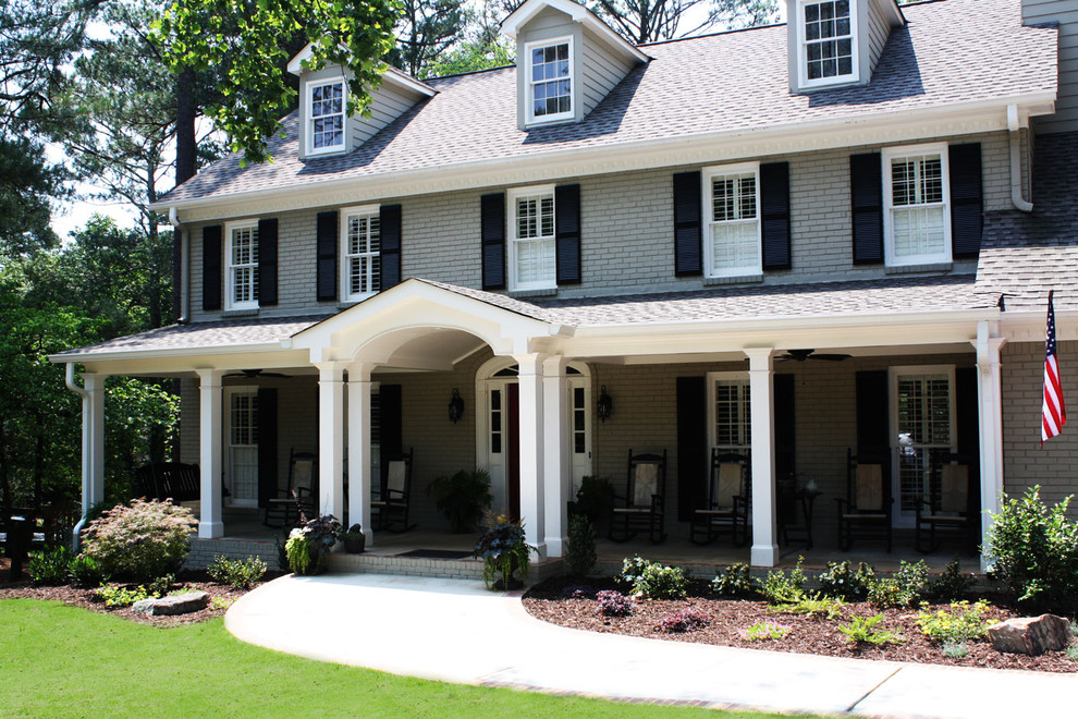 This is an example of a large traditional three-storey grey exterior in Atlanta with wood siding.
