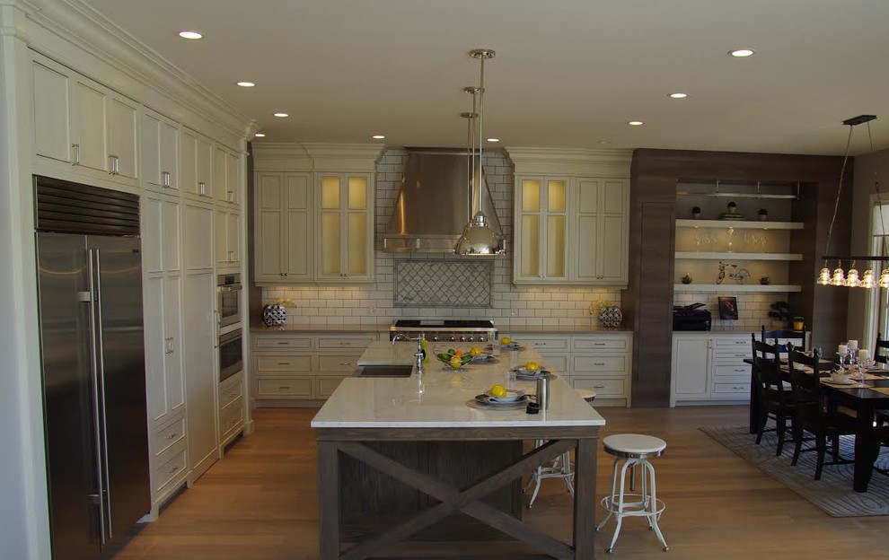 Example of a transitional kitchen design in Calgary