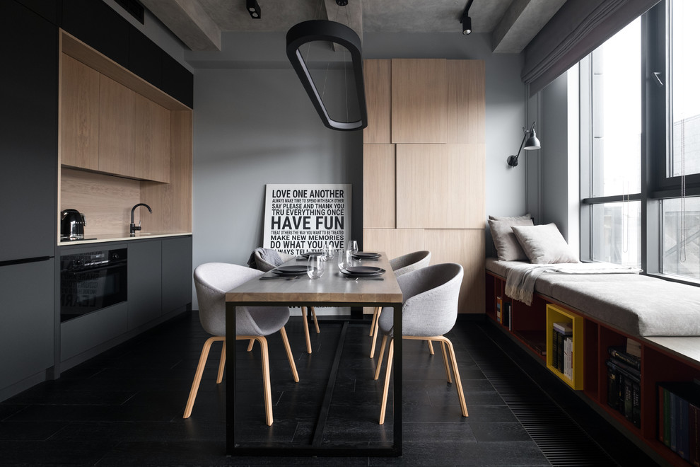 Inspiration for a small contemporary single-wall eat-in kitchen in Moscow with flat-panel cabinets, black cabinets, beige splashback, black appliances and black floor.
