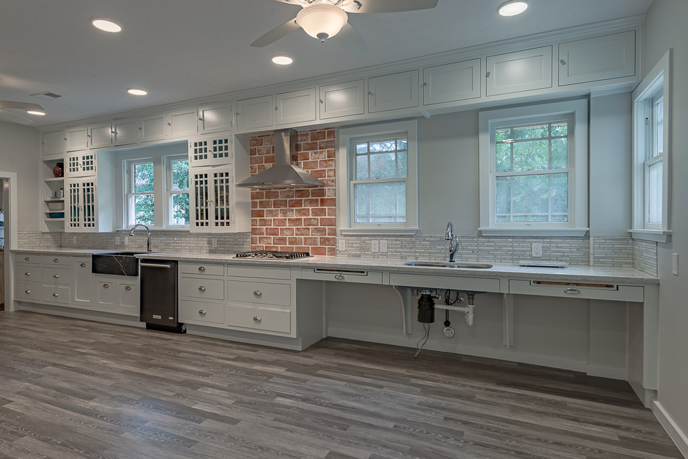 Example of a large mountain style galley dark wood floor eat-in kitchen design in Austin with a farmhouse sink, open cabinets, white cabinets, quartzite countertops, multicolored backsplash, marble backsplash, stainless steel appliances and no island
