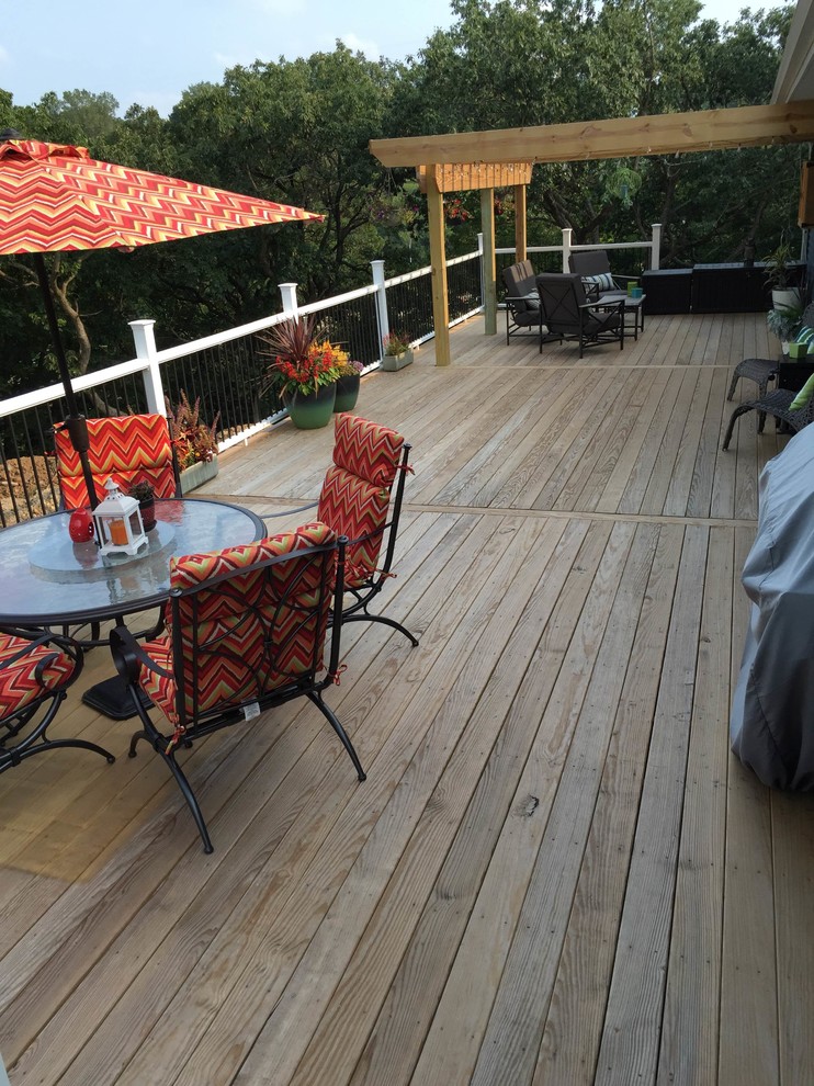 Deck - backyard deck idea in Cedar Rapids with a pergola
