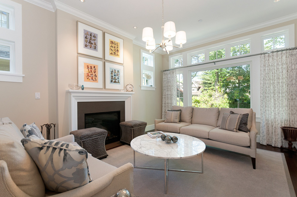 Mid-sized traditional living room in Vancouver with beige walls and a standard fireplace.
