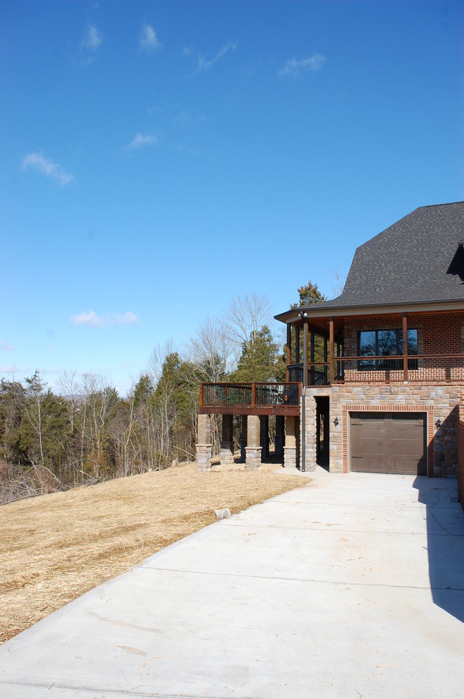 Inspiration for a rustic brown three-story brick exterior home remodel