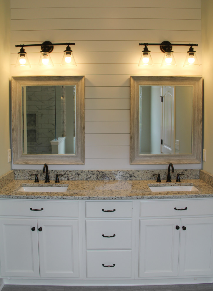 Traditional master bathroom in Birmingham with white cabinets, white walls, granite benchtops, a double vanity, a built-in vanity and planked wall panelling.