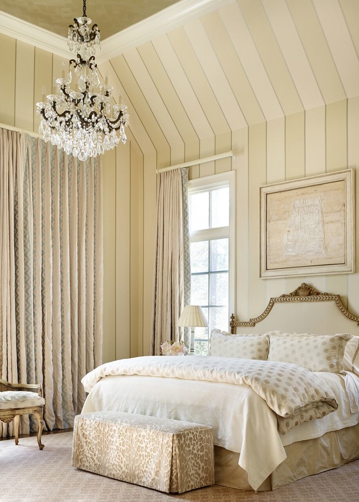 Design ideas for a traditional master bedroom in Atlanta with beige walls and carpet.