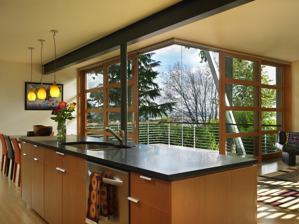 Photo of a contemporary kitchen in Seattle with flat-panel cabinets and light wood cabinets.