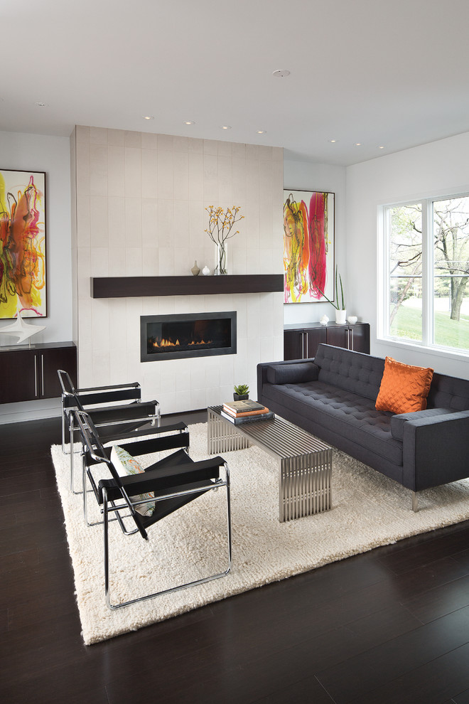 This is an example of a mid-sized contemporary formal enclosed living room in Indianapolis with bamboo floors, white walls, a ribbon fireplace and no tv.