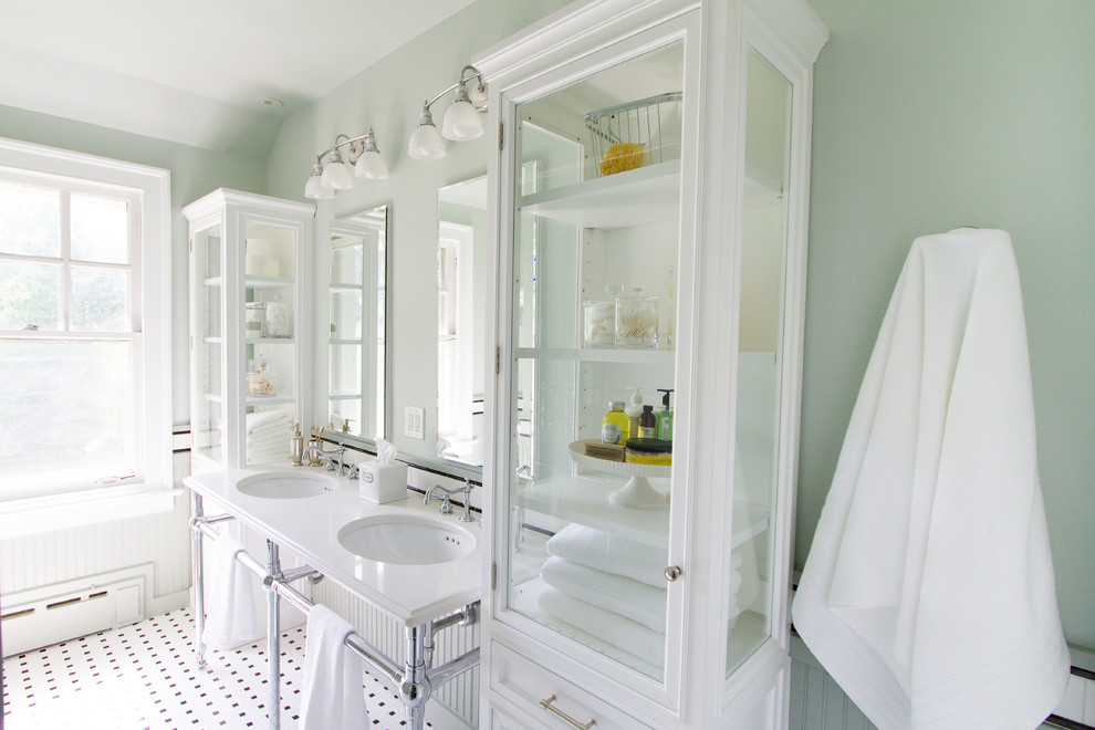 Small transitional kids bathroom in Other with a console sink, beaded inset cabinets, white cabinets, engineered quartz benchtops, a drop-in tub, a shower/bathtub combo, a two-piece toilet, white tile, ceramic tile, green walls and mosaic tile floors.