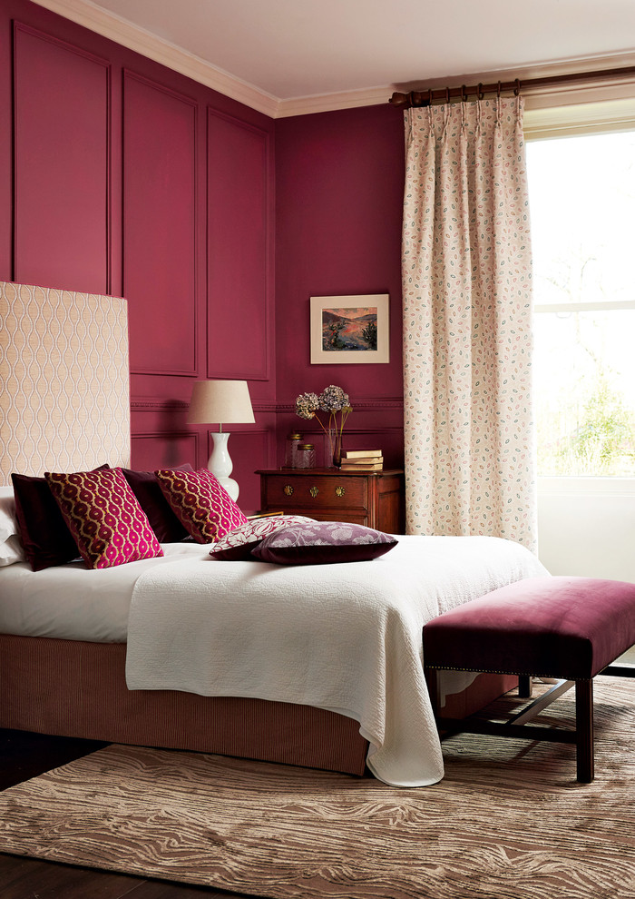 Inspiration for a transitional master bedroom in London with pink walls.